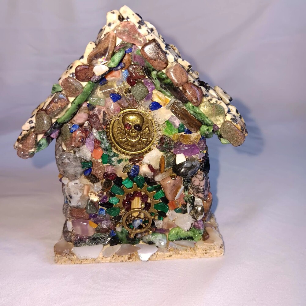 A Pirates Bird House Uv reactive Crystal and Wood Comes with black light.